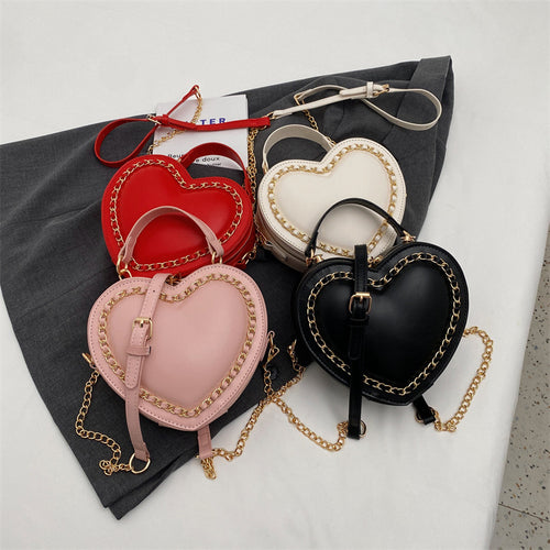 Heart-shaped embroidered handbag
