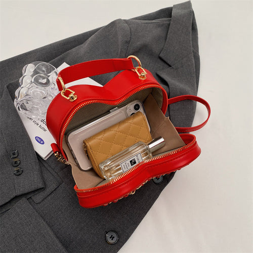 Heart-shaped embroidered handbag